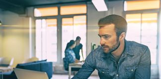 Jordan in the Cloud Man with lapotop on a desk working on some ict business